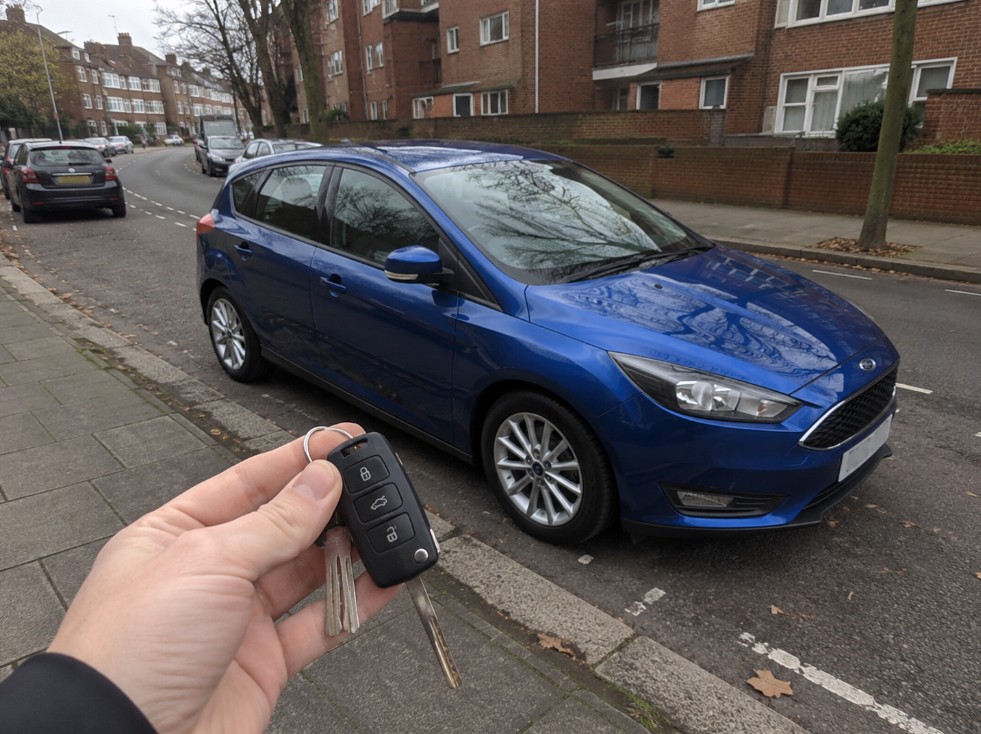 Car key stuck in ignition being inspected by auto locksmith in Enfield